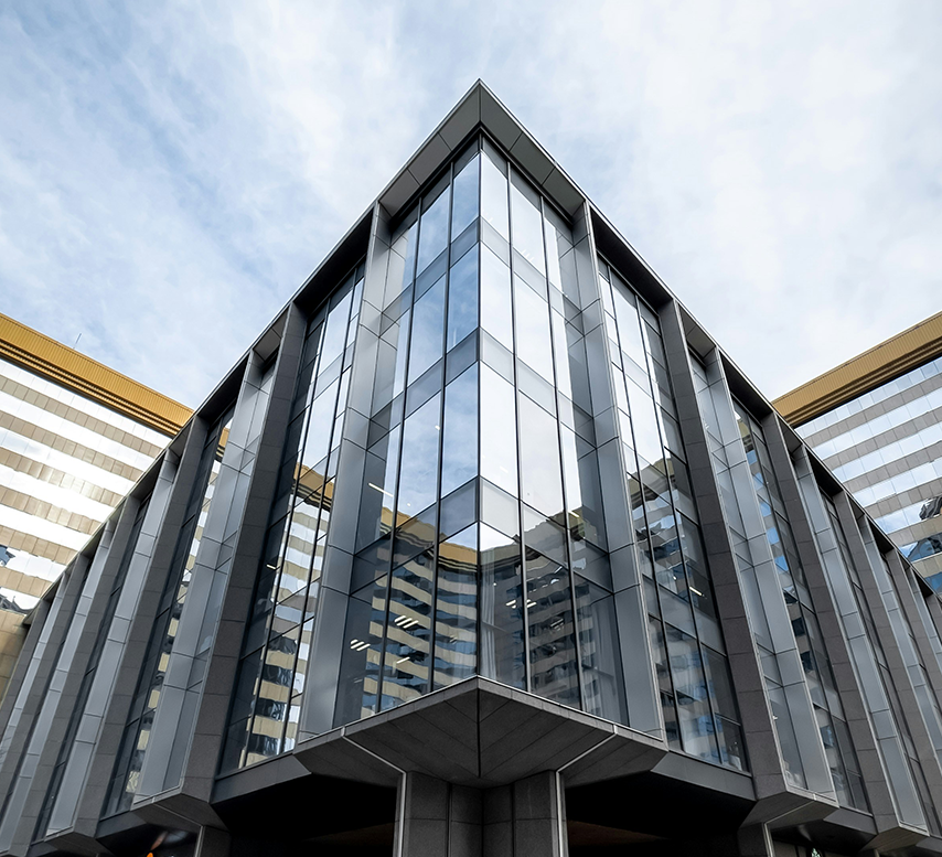 A building with many windows and a sky background