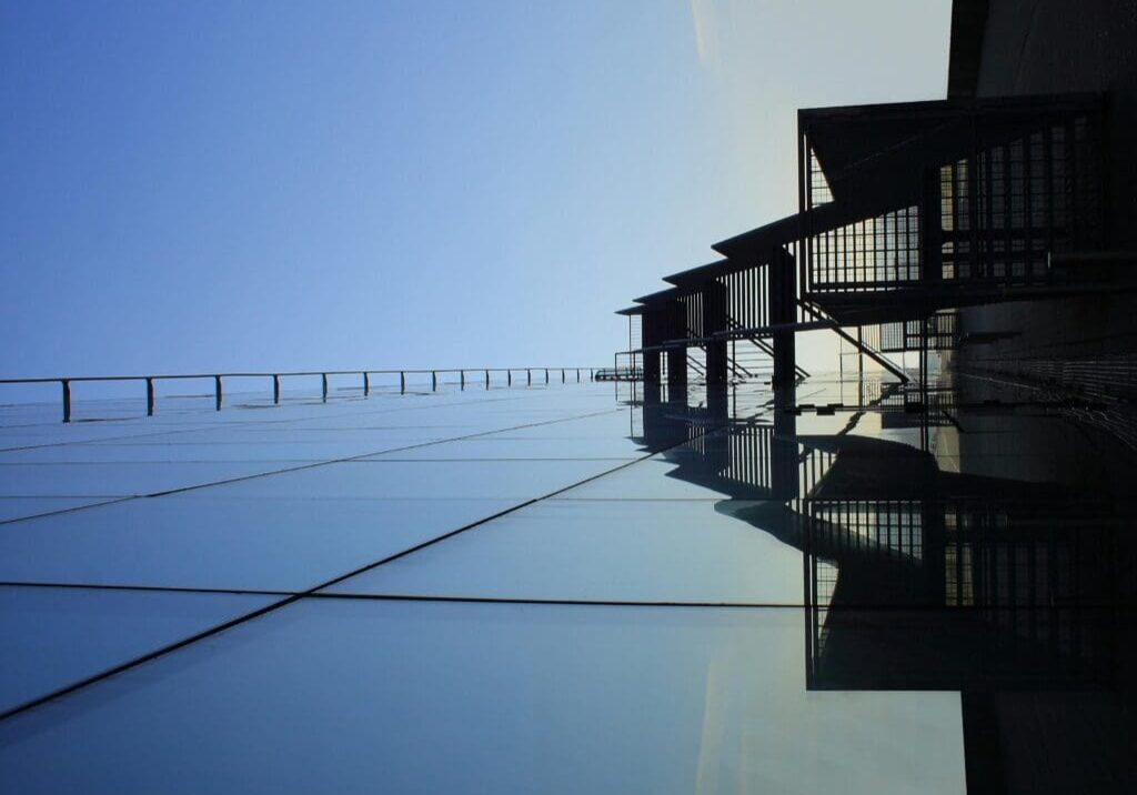 A building with reflection of the sky in it.